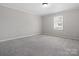 Spacious bedroom featuring neutral carpet, a large window, and fresh, neutral paint at 405 N Wilson St # 103, Rock Hill, SC 29730