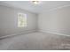 Bedroom featuring neutral carpet, a large window, and fresh, neutral paint at 405 N Wilson St # 103, Rock Hill, SC 29730