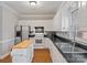 Well-lit kitchen with white cabinets, black countertop, stainless steel appliances, and a wood-top island at 405 N Wilson St # 103, Rock Hill, SC 29730