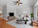 Bright living room featuring hardwood floors, ceiling fan, and stylish furniture arrangement at 405 N Wilson St # 103, Rock Hill, SC 29730
