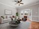 Bright living area with a cozy seating arrangement and a bay window, creating an inviting atmosphere at 405 N Wilson St # 103, Rock Hill, SC 29730