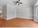 Spacious living room with hardwood flooring, complemented by elegant crown molding and ample natural light at 405 N Wilson St # 103, Rock Hill, SC 29730