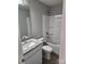 This bathroom has tiled countertops, modern faucets, and a shower-tub combo at 4168 S Olivers Cross Rd # 6, Newton, NC 28658