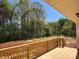 Wood deck overlooks a backyard with lush trees, offering a peaceful outdoor space at 4168 S Olivers Cross Rd # 6, Newton, NC 28658