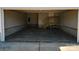 Open garage with concrete floor and wooden stairs leading to the door at 4168 S Olivers Cross Rd # 6, Newton, NC 28658