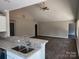 Open-concept kitchen with a granite-topped breakfast bar overlooking the living area, ideal for modern living and entertaining at 4168 S Olivers Cross Rd # 6, Newton, NC 28658