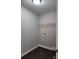 Laundry room has wood-look flooring and white wire shelving at 4168 S Olivers Cross Rd # 6, Newton, NC 28658
