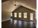 Bright living room featuring high ceilings, a ceiling fan, multiple windows, and dark hardwood floors, perfect for gatherings at 4168 S Olivers Cross Rd # 6, Newton, NC 28658