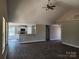 Spacious living room with hardwood floors, high ceilings, and an open view to the kitchen, creating a modern and airy feel at 4168 S Olivers Cross Rd # 6, Newton, NC 28658