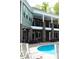 Beautiful backyard pool area with outdoor seating and covered balcony at 447 Shagbark Ct, Mount Gilead, NC 27306