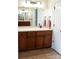 Bathroom with a large mirror and wooden vanity with lots of storage at 447 Shagbark Ct, Mount Gilead, NC 27306