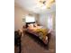 Bright bedroom with a sunflower blanket and neutral grey walls at 447 Shagbark Ct, Mount Gilead, NC 27306