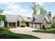 Stunning brick home with a three-car garage and a well-manicured front lawn near the water at 447 Shagbark Ct, Mount Gilead, NC 27306