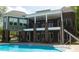 Stunning multi-story home features a spacious balcony overlooking the pool and backyard at 447 Shagbark Ct, Mount Gilead, NC 27306