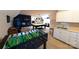 Spacious game room with foosball table, pool table, wet bar, and sports memorabilia at 447 Shagbark Ct, Mount Gilead, NC 27306