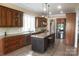 Well-equipped kitchen with granite countertops, an island with seating, and stainless steel appliances at 447 Shagbark Ct, Mount Gilead, NC 27306