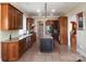 Gourmet kitchen with custom cabinets, a central island, and stainless-steel appliances at 447 Shagbark Ct, Mount Gilead, NC 27306