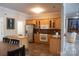 Bright kitchen with stainless steel appliances and breakfast bar at 447 Shagbark Ct, Mount Gilead, NC 27306