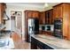 Modern kitchen featuring a stainless-steel refrigerator, custom cabinets, and a functional island at 447 Shagbark Ct, Mount Gilead, NC 27306