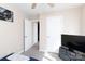 This carpeted bedroom features two white doors and a wall-mounted television at 4707 Hannah Dr, Rock Hill, SC 29732
