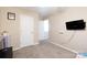 A cozy bedroom with neutral walls and carpet features a wall-mounted TV for entertainment at 4707 Hannah Dr, Rock Hill, SC 29732