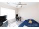 A simple bedroom with carpet, a ceiling fan, and a desk by the window, offering a cozy space at 4707 Hannah Dr, Rock Hill, SC 29732
