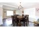 Elegant dining room with a chandelier, large window, and a spacious table for Gathering gatherings at 4707 Hannah Dr, Rock Hill, SC 29732