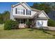 Lovely two-story home with brick accents, lush greenery, and a two-car garage, perfect for families at 4707 Hannah Dr, Rock Hill, SC 29732