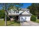 Charming two-story home featuring a two-car garage, brick accents, and a well-manicured lawn at 4707 Hannah Dr, Rock Hill, SC 29732