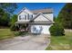 A charming two-story home showcasing a well-maintained lawn, two-car garage, and inviting curb appeal at 4707 Hannah Dr, Rock Hill, SC 29732