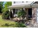 Inviting front porch with brick detailing, lush landscaping, and a charming entrance to the home at 4707 Hannah Dr, Rock Hill, SC 29732