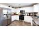Bright kitchen featuring stainless steel appliances, white cabinetry, and plenty of room for meal preparation at 4707 Hannah Dr, Rock Hill, SC 29732