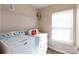 Functional laundry room featuring a washing machine, dryer, and shelving for storage at 4707 Hannah Dr, Rock Hill, SC 29732