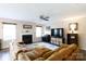 Cozy living room features a fireplace and a large brown comfortable sectional at 4707 Hannah Dr, Rock Hill, SC 29732