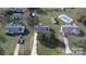 Aerial view of multiple properties, showcasing mature landscaping and pool at 507 Texas Trl, Dallas, NC 28034