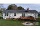 Exterior features a wooden deck, siding, and a fire pit at 507 Texas Trl, Dallas, NC 28034