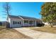 Traditional single-story home with neutral siding, dark shutters, and a well-maintained front yard at 507 Texas Trl, Dallas, NC 28034