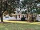 Charming single-story home featuring a welcoming front yard and a bright red front door at 507 Texas Trl, Dallas, NC 28034