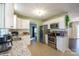 This kitchen features white cabinets, granite countertops, and stainless steel appliances at 507 Texas Trl, Dallas, NC 28034