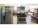 This kitchen features white cabinets, granite countertops, and stainless steel appliances at 507 Texas Trl, Dallas, NC 28034