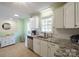 This kitchen features white cabinets, granite countertops, and stainless steel appliances at 507 Texas Trl, Dallas, NC 28034