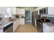 This kitchen features white cabinets, granite countertops, and stainless steel appliances at 507 Texas Trl, Dallas, NC 28034