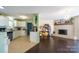 Open-concept living room and kitchen area with hardwood floors and modern lighting at 507 Texas Trl, Dallas, NC 28034