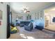 Open-concept living room with dark furniture, carpet floors, and view to kitchen at 507 Texas Trl, Dallas, NC 28034