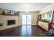 Bright living room featuring a brick fireplace, sliding glass doors, and stylish furniture at 507 Texas Trl, Dallas, NC 28034