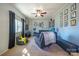 Cozy living room featuring carpet floors, a dark sofa set, and ample room for seating at 507 Texas Trl, Dallas, NC 28034
