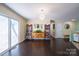 Spacious living room with wood floors, sliding glass doors, and stylish shelving at 507 Texas Trl, Dallas, NC 28034