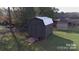 Outbuilding with metal roof offers additional storage at 507 Texas Trl, Dallas, NC 28034