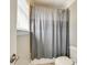 Bathroom featuring a shower with a striped curtain and white toilet at 5103 Trinity Trace Ln, Monroe, NC 28110