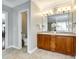 Bathroom with double vanity, tile floors, and a separate toilet room for added privacy at 5103 Trinity Trace Ln, Monroe, NC 28110